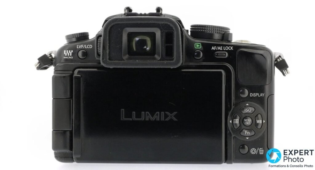 Panasonic Lumix G1 de dos, écran orientable replié logo LUMIX vers l'extérieur, viseur électronique et pavé.